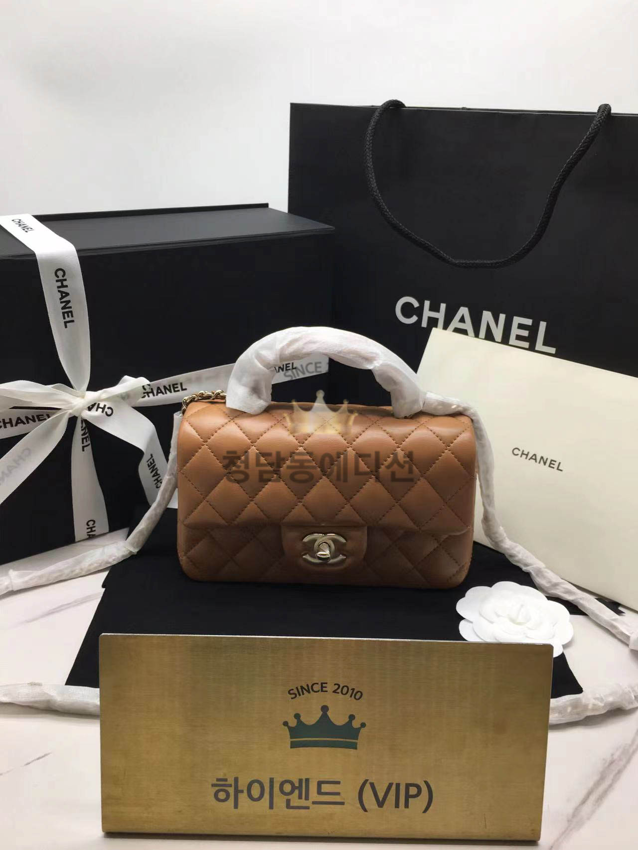 샤넬 클래식 뉴미니 탑핸들 플랩백